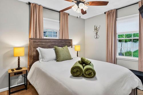 a bedroom with a bed with two towels on it at Cozy Corner in Terre Haute