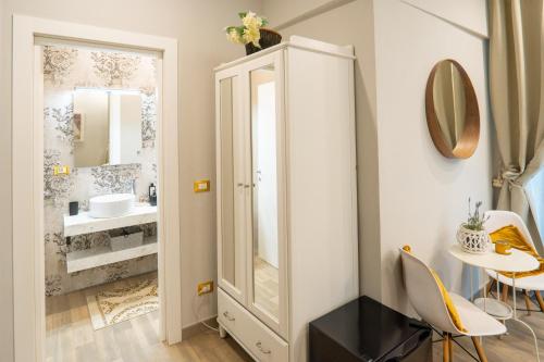 a bathroom with a sink and a mirror at Covo di Levante, in La Spezia