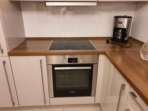 a kitchen with a counter with a stove top oven at HomeComfort in Cologne