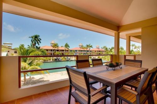 a dining room with a view of the ocean at Magnificent Belize Townhouse-Pool-Private Island in Placencia