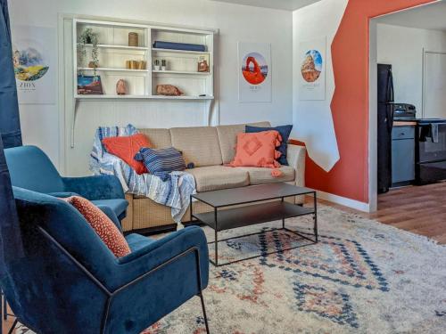 a living room with a couch and two chairs at Pet-Friendly Downtown Kanab Basecamp | Hot Tub in Kanab