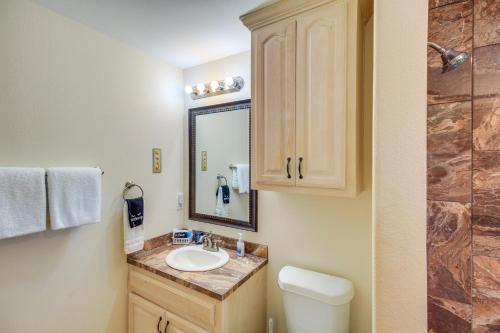 a bathroom with a sink and a mirror at 'Sea-King Sol' Ocean-View Condo in Port Aransas! in Port Aransas