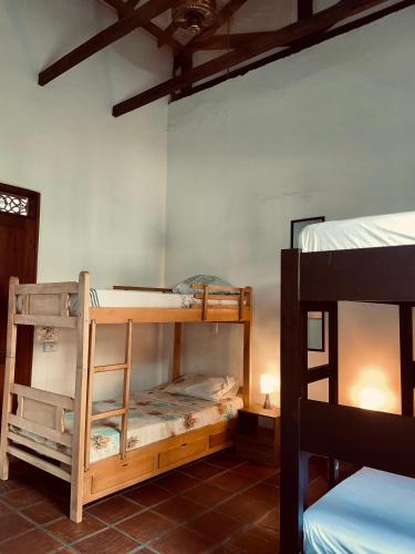 a room with two bunk beds in a room at HOTEL CASA BRESSE in Cali