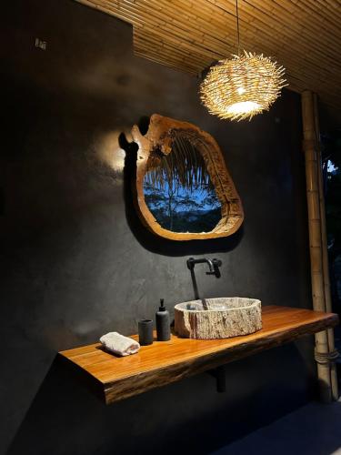 a bathroom with a sink and a mirror at Kapiro Ecolodge Satipo in Satipo