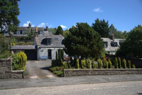 a house with a driveway in front of it at Lily Bank Room in Stonehaven
