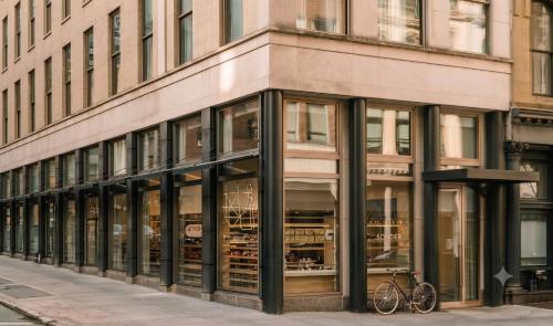 a store front with glass windows on a city street at Duane Street Hotel Tribeca, Belvilla District 6 Formerly Sonder in New York