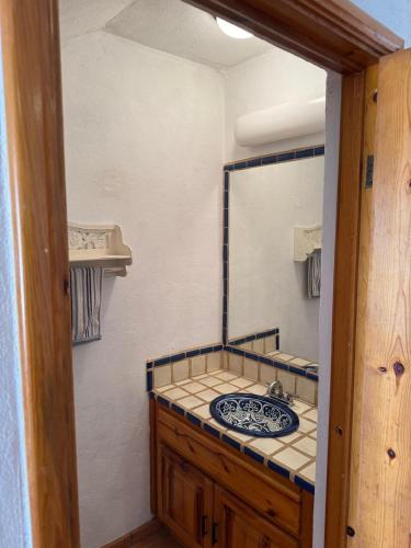 a bathroom with a sink and a mirror at Paradise Villa #5 in Puerto Peñasco