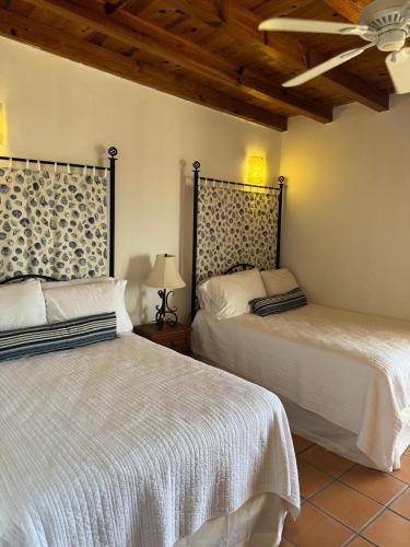 two beds sitting next to each other in a bedroom at Paradise Villa #5 in Puerto Peñasco
