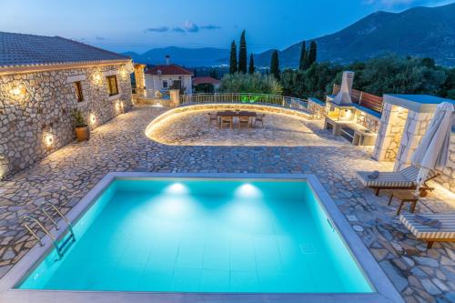 a swimming pool in the backyard of a house at Villa Amantia in Chaliotata