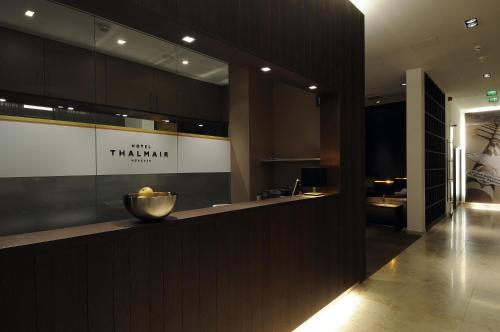 a kitchen with a bowl of fruit on a counter at Hotel Thalmair in Munich