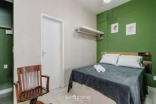 a bedroom with a bed with a stuffed animal on it at Studio the city center 300m Pelourinho HAI0203 in Salvador