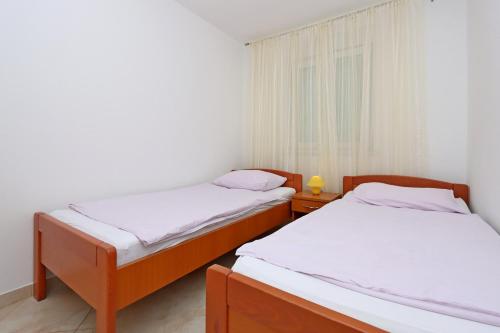 Apartments by the sea Kampor, Rab - 24554