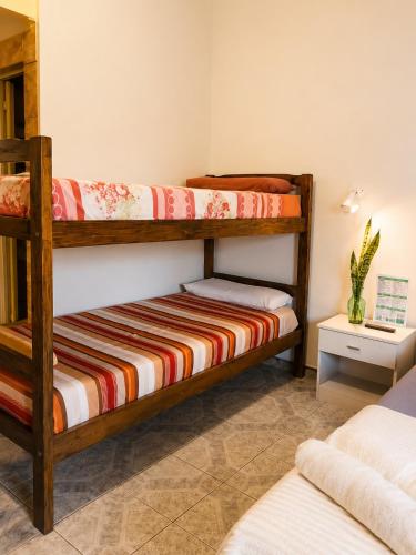 a bedroom with two bunk beds in a room at JM Resort Iguazu in Puerto Iguazú