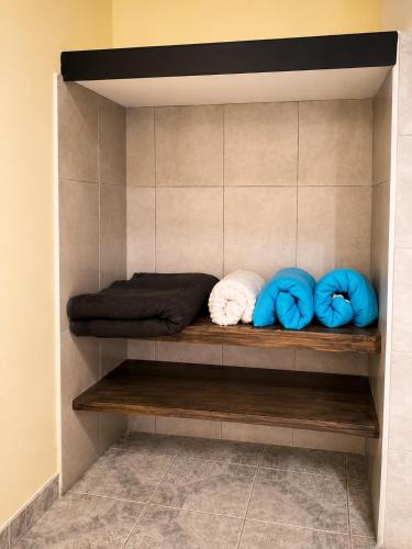 a room with three pillows on a wooden shelf at JM Resort Iguazu in Puerto Iguazú