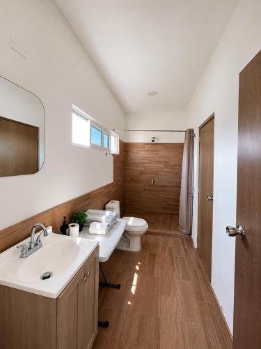 a bathroom with a sink and a toilet at Esterito Hostel in La Paz