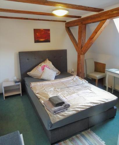 a small bedroom with a bed with at Alb Hotel Schalksburg in Albstadt