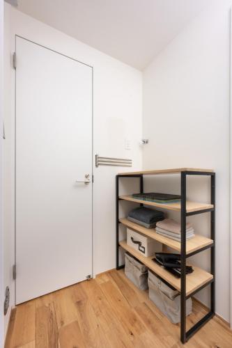a room with a closet with a door and wooden floors at Obaranchi - Vacation STAY 18154 in Kawasaki