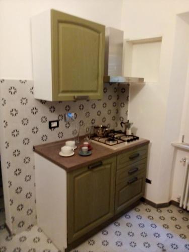 a kitchen with a sink and a stove at volterracentro in Volterra