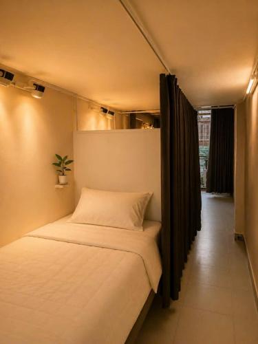 a small bedroom with a bed in a room at Lê Gia Homestay 2 in Hue