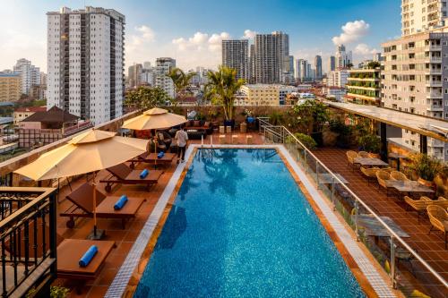 a swimming pool on the roof of a building at Amana Hotel Phnom Penh in Phnom Penh