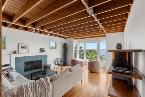 a living room with a couch and a fireplace at Vista Mare in Rockport
