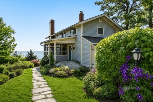 a house with a garden in front of it at Vista Mare in Rockport