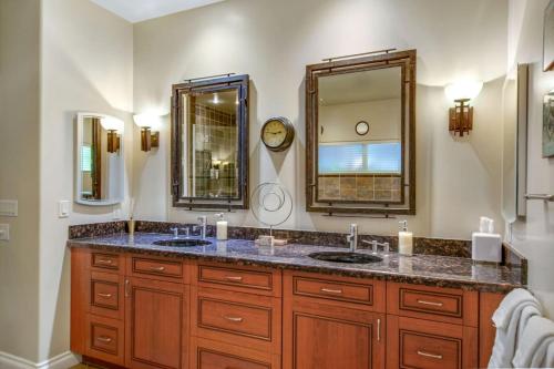 a bathroom with two sinks and a large mirror at NEW Relax & Explore from MissionViejo | Pool | Spa in Mission Viejo
