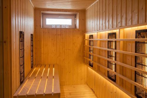 a hallway with a bench in a library at Villa Cujez with Pool & Sauna - Happy Rentals in Rečica ob Savinji