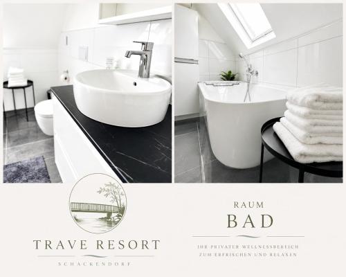 a white bathroom with a sink and a bath tub at Trave Resort Ferienhaus in Schackendorf
