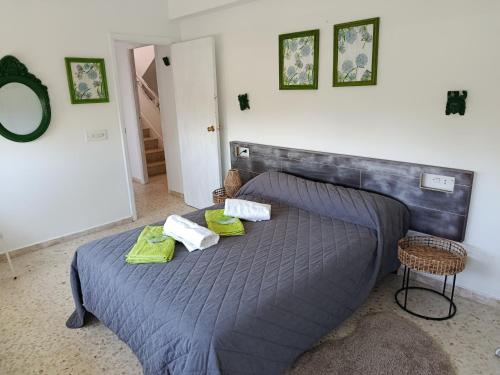 a bedroom with a bed with two pillows on it at Chalet Lanzada in Sanxenxo