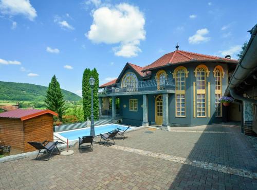 a house with a swimming pool in front of it at Requiem Rustical Heaven Villa with Outdoor Pool in Varaždin