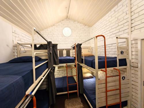 a room with two bunk beds and a window at Hangover Hostels Mirissa in Mirissa