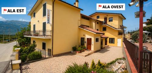 a villa with a view of a house at Complesso Turistico Aurora - camere & Appartamenti in Poggio Picenze