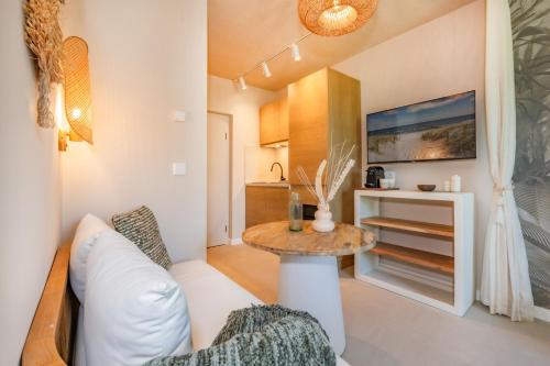 a living room with a white couch and a table at BALI BLIZZ - App 11 in Benz