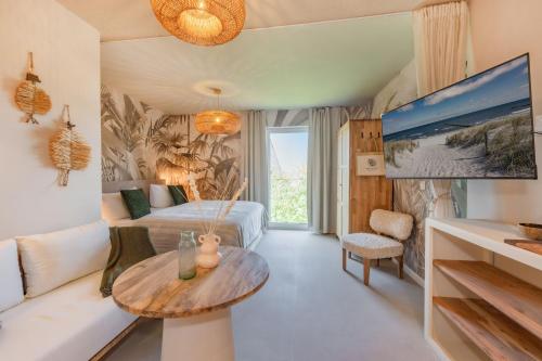 a living room with a couch and a table at BALI BLIZZ - App 12 in Benz