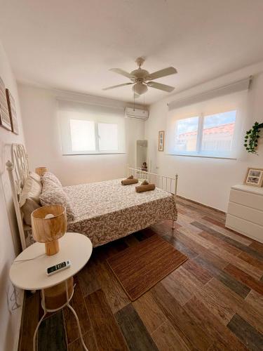 a bedroom with a bed and a ceiling fan at Vittoria House Garden in Bayahibe
