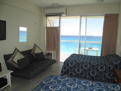 Voodi või voodid majutusasutuse Apartment Cancun toas