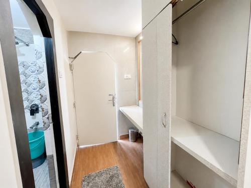 a small bathroom with a sink and a mirror at Hotel SVD HARIDWAR in Haridwār