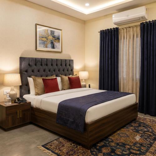 a bedroom with a large bed in a room at Hotel Grand Heaven in Tājganj
