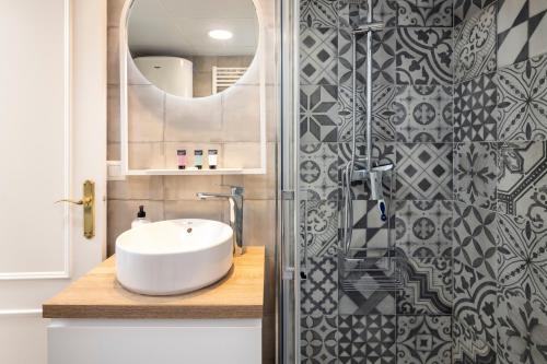 a bathroom with a white sink and a shower at Beachfront Apt Torrox Costa in Torrox