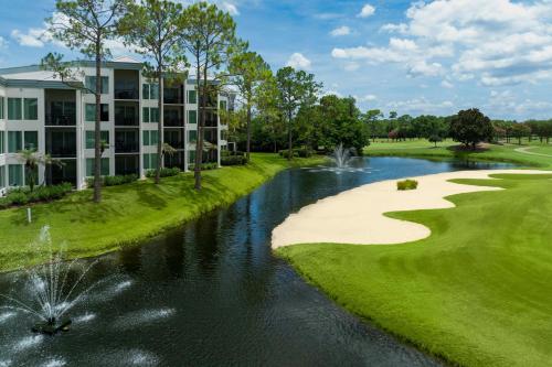 a rendering of the golf course at the resort with a river at Marriott's Royal Palms in Orlando
