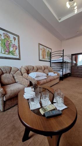 a living room with a coffee table and a couch at Барселона in Odesa