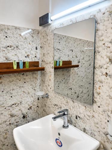 a bathroom with a sink and a mirror at Leo's Cozy Cabin in Ella