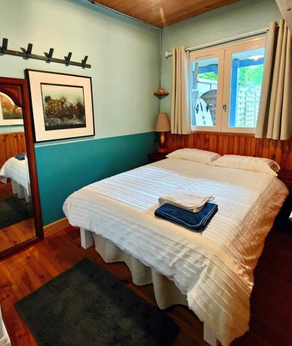 a bedroom with a bed with a towel on it at Shifting Sands Surf House in Labenne