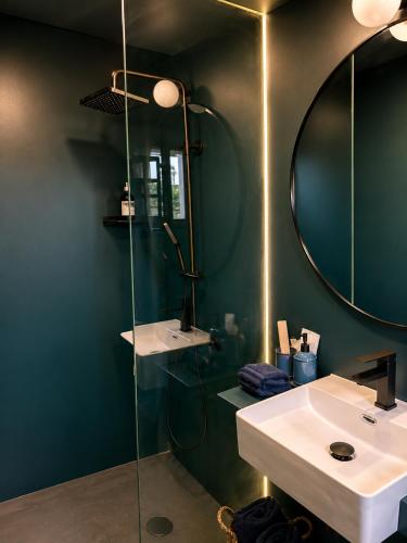 a bathroom with a sink and a mirror at Isabelina Stays near Doñana & the Coast in Sanlúcar de Barrameda