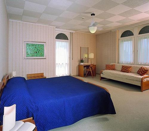 Säng eller sängar i ett rum på Hotel Terminus