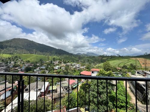 a view from a balcony of a town with mountains at Prabhaz grand villa in Hatton