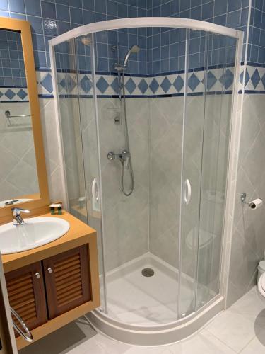 a bathroom with a shower and a sink at Résidence Des Équipages in Le Castellet