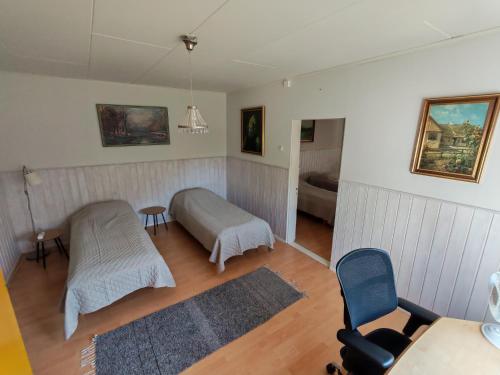 a living room with a bed and a couch at Guesthouse Veteli in Veteli