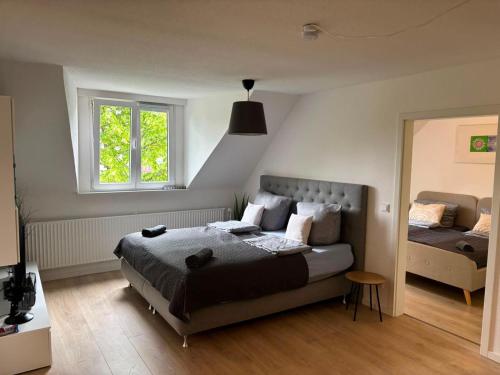 a bedroom with a bed and a window at Appartement-Koblenz in Koblenz